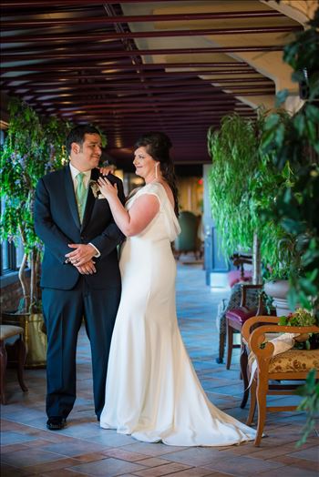 Mary and Alejandro 14 - Wedding photography at the Historic Santa Maria Inn in Santa Maria, California by Mirror\u0027s Edge Photography. Bride and Groom in breezeway between the Taproom and the Front Desk at the Santa Maria Inn after wedding.