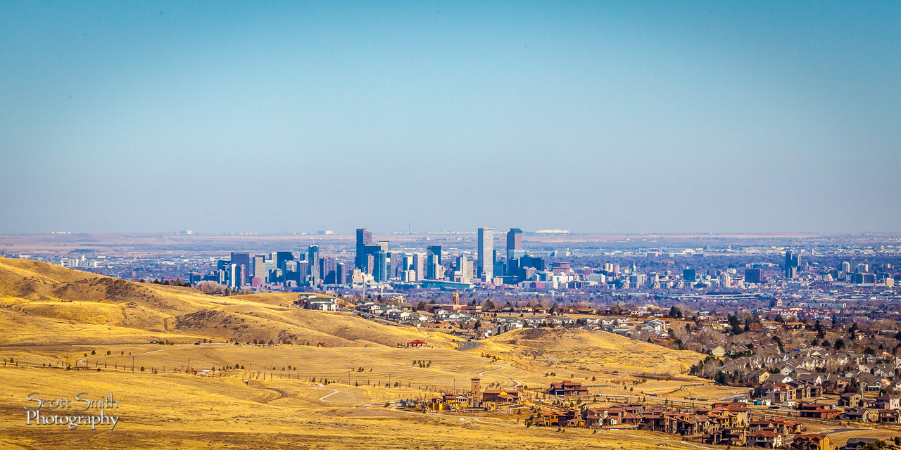 A Hill with a View From Morrison, CO - a view of downtown Denver, and even the white canopies of the airport terminals in the distance. by Scott Smith Photos