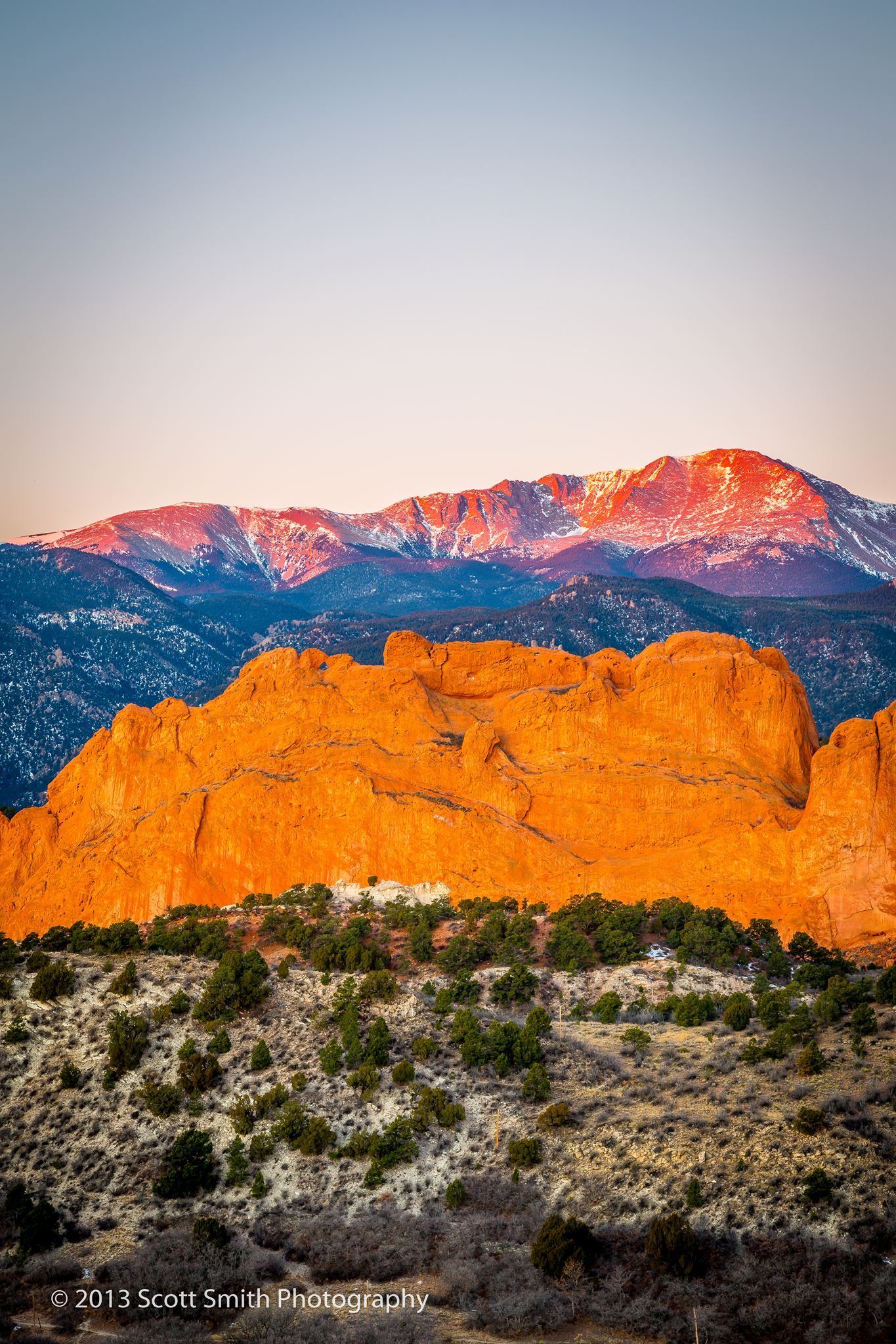 Morning Peaks Pike's Peak, behind the Garden of the Gods, lit by the rising sun. by Scott Smith Photos