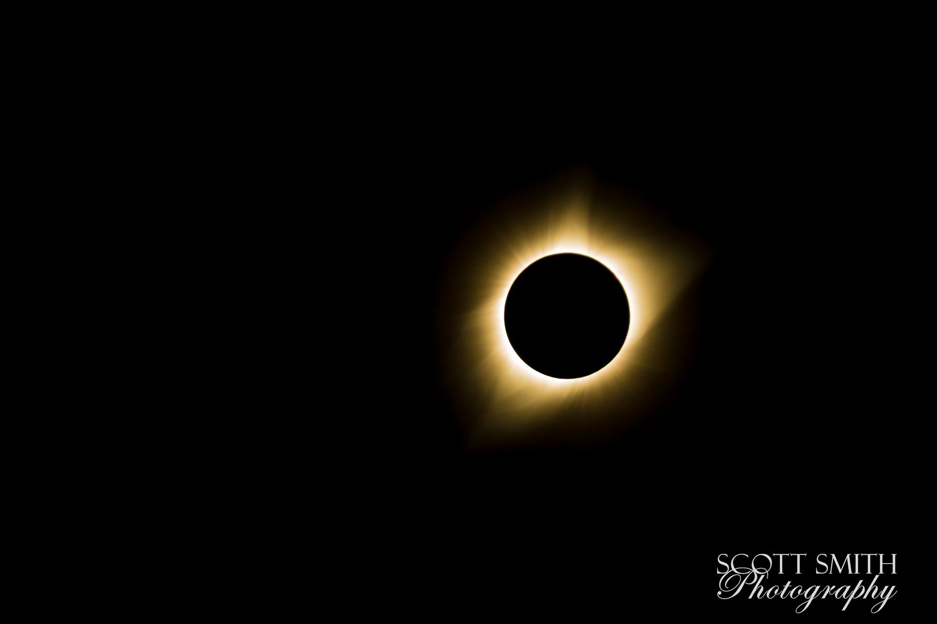 2017 Solar Eclipse 12 B Total solar eclipse, at Carhenge in Alliance. Nebraska August 21, 2017, adjusted to remove the point of light in the left center of the frame. by Scott Smith Photos