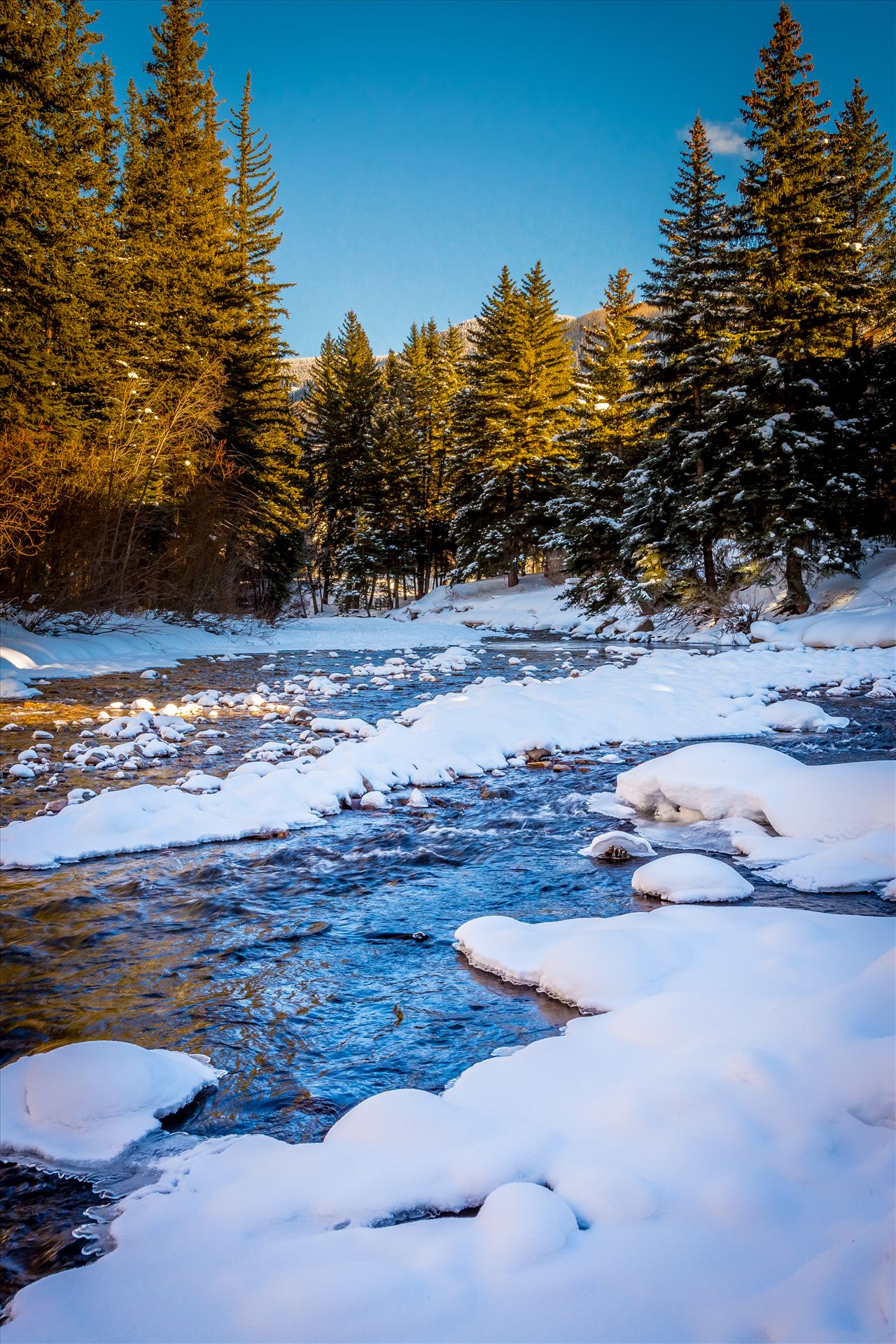 Vail Mountain Stream The stream that flows through Vail, Colorado, near the famous covered bridge. by Scott Smith Photos