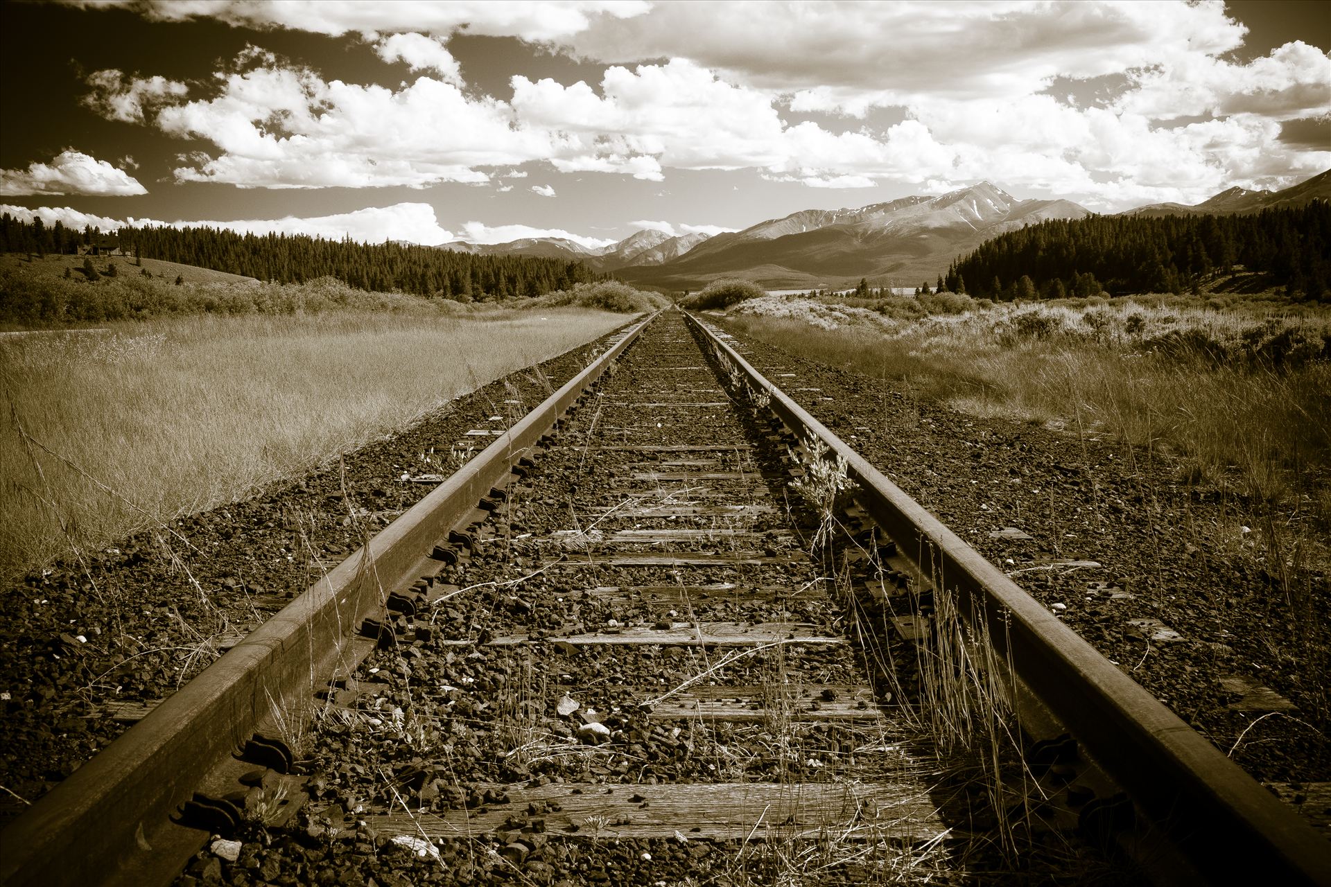Infinity Tracks Miles of railroad tracks going into the distance outside of Leadville, Colorado. by Scott Smith Photos