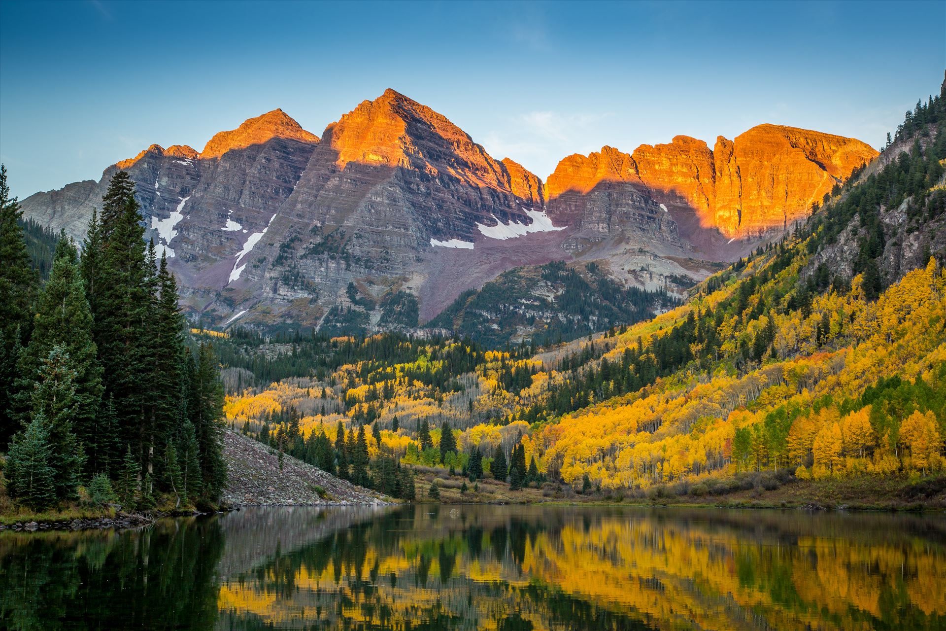 Maroon Bells Fall Sunrise The rising sun lights the peaks of the Maroon Bells. by Scott Smith Photos