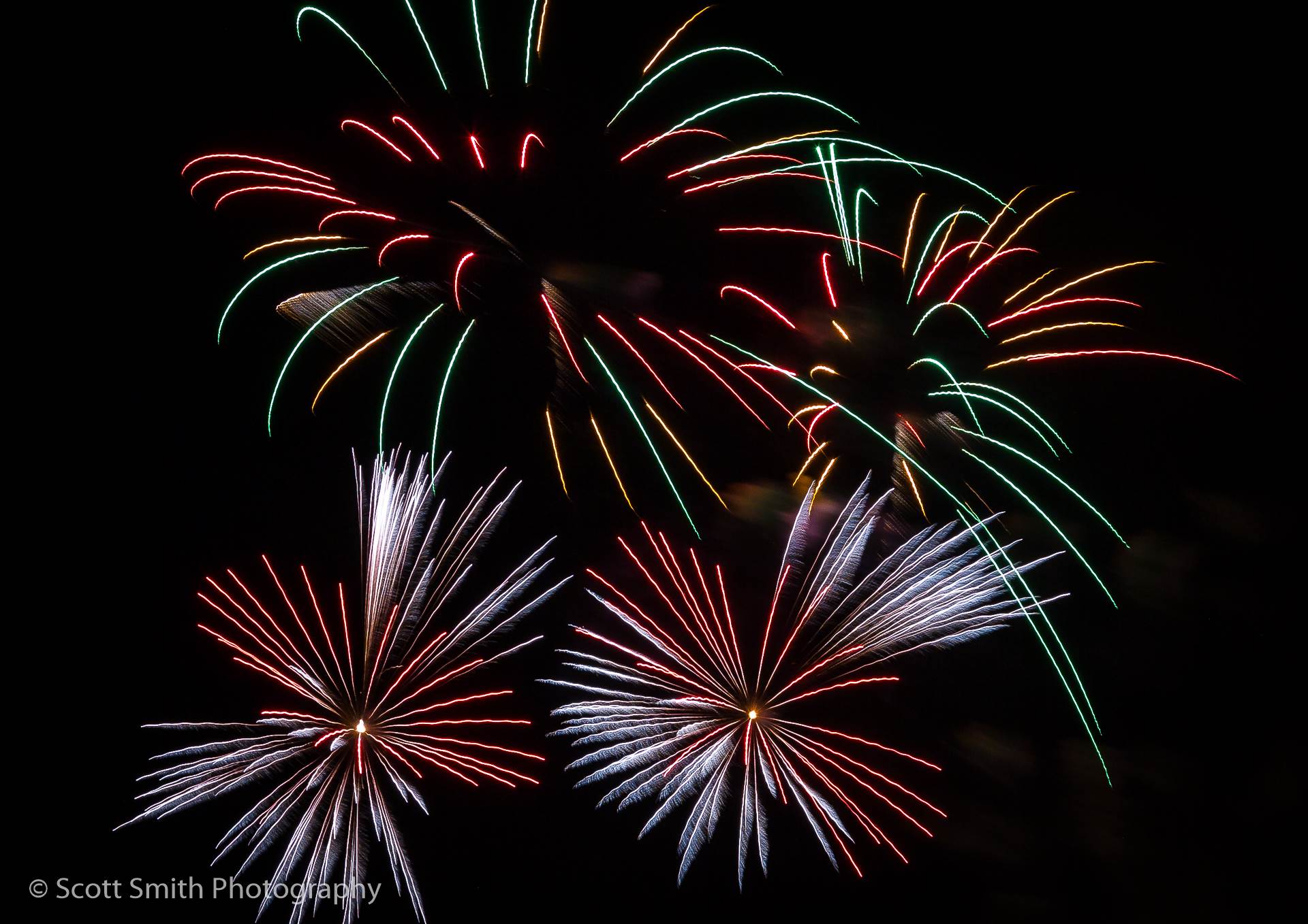 Fireworks in Denver The long, sparse trails create interesting patterns in the sky. by Scott Smith Photos