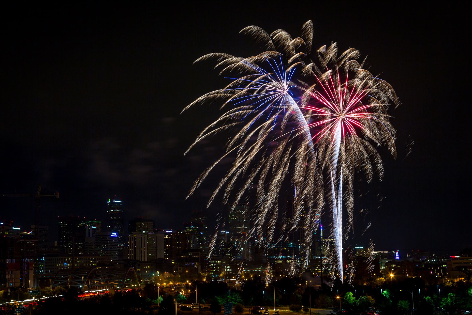 Elitch's Fireworks 2016 - Red White and Blue Fireworks from Elitch Gardens, taken near Speer and Zuni in Denver, Colorado. by Scott Smith Photos