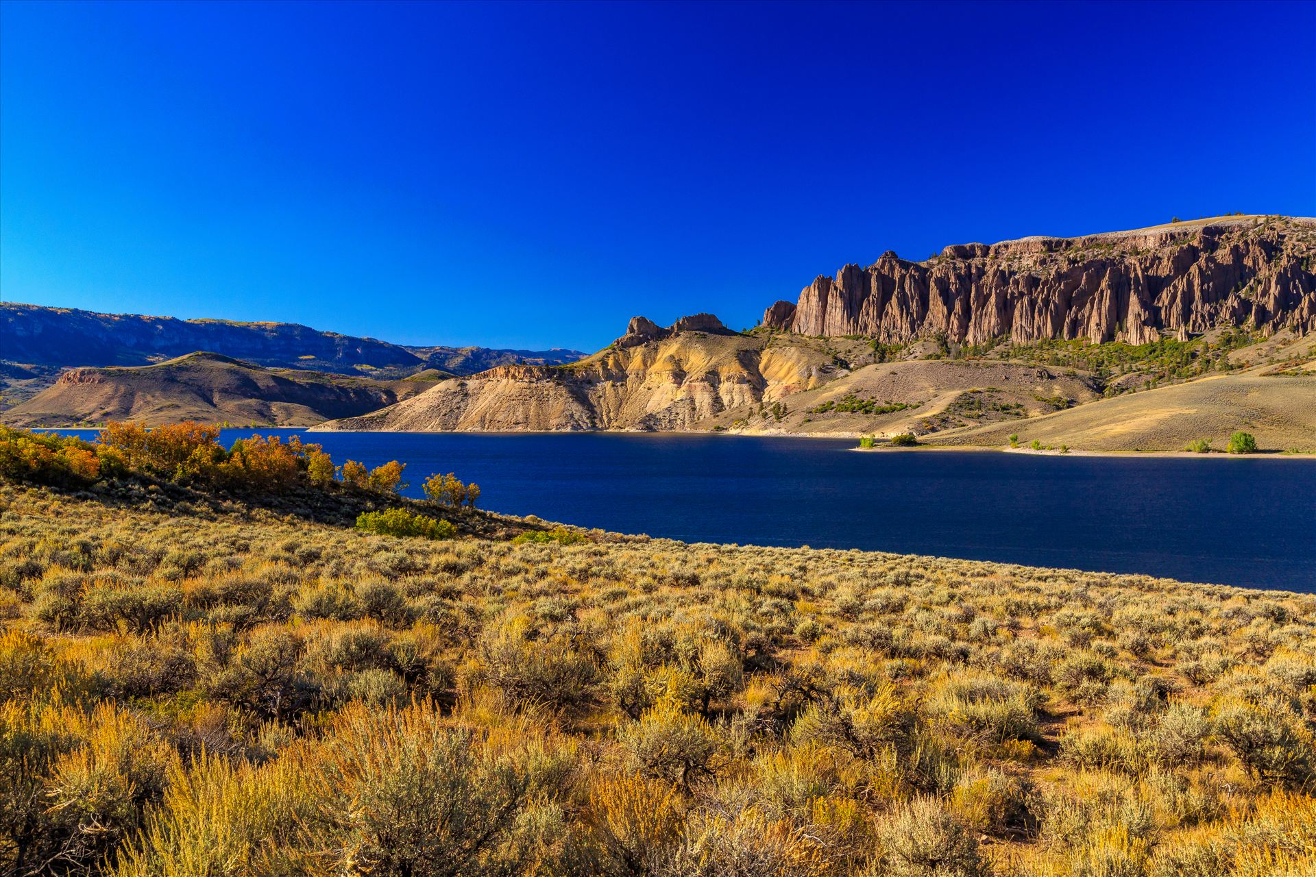 Dillon Pinnacles and Gunnison River The Dillon Pinnacles tower over the beautiful Gunnison River, near Gunnison Colorado. by Scott Smith Photos