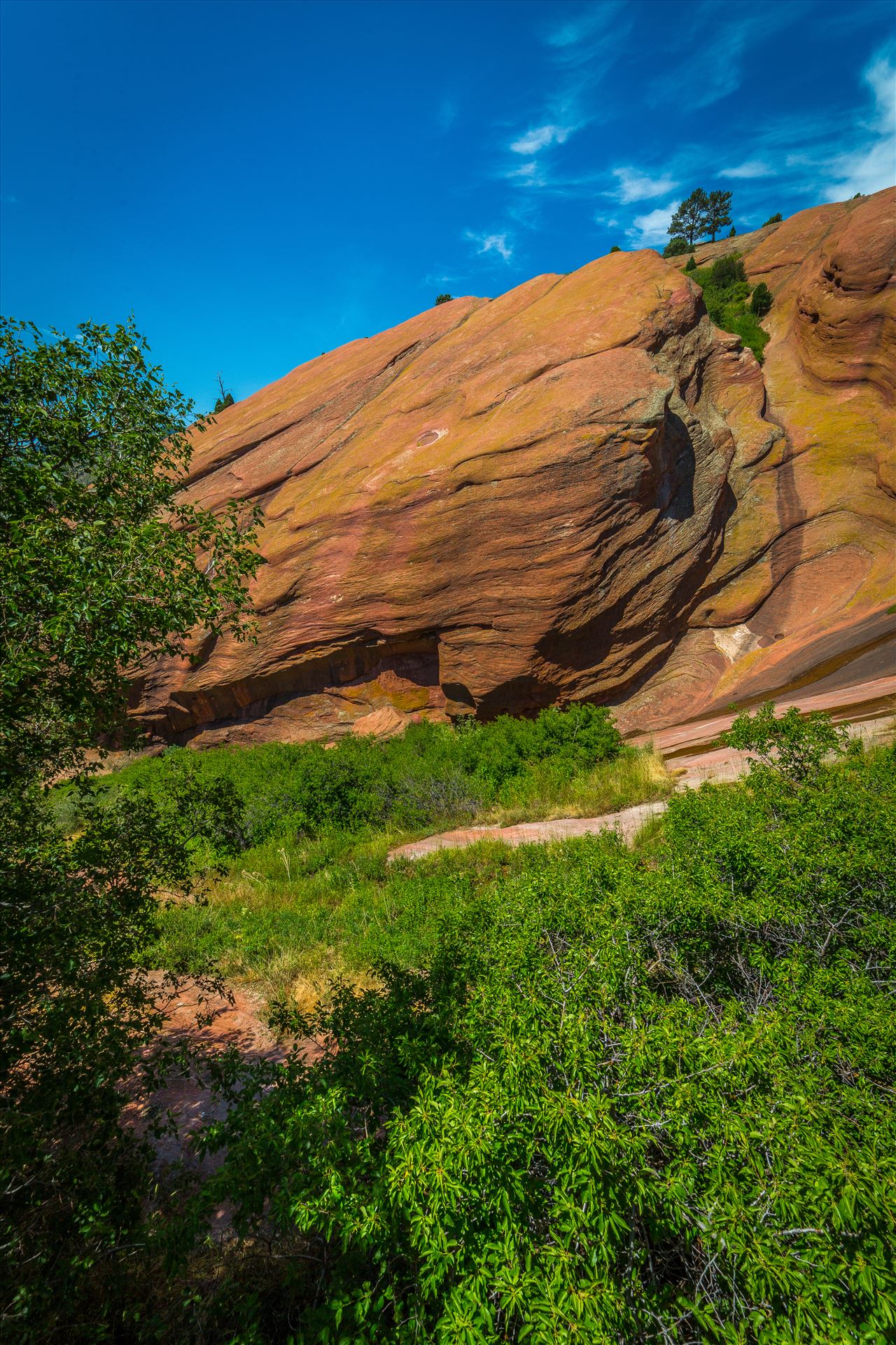 Red Rocks Park From the Trading Post in Red Rocks Park, a brilliant blue-bird sky brings out all the colors in the area's geological features. by Scott Smith Photos