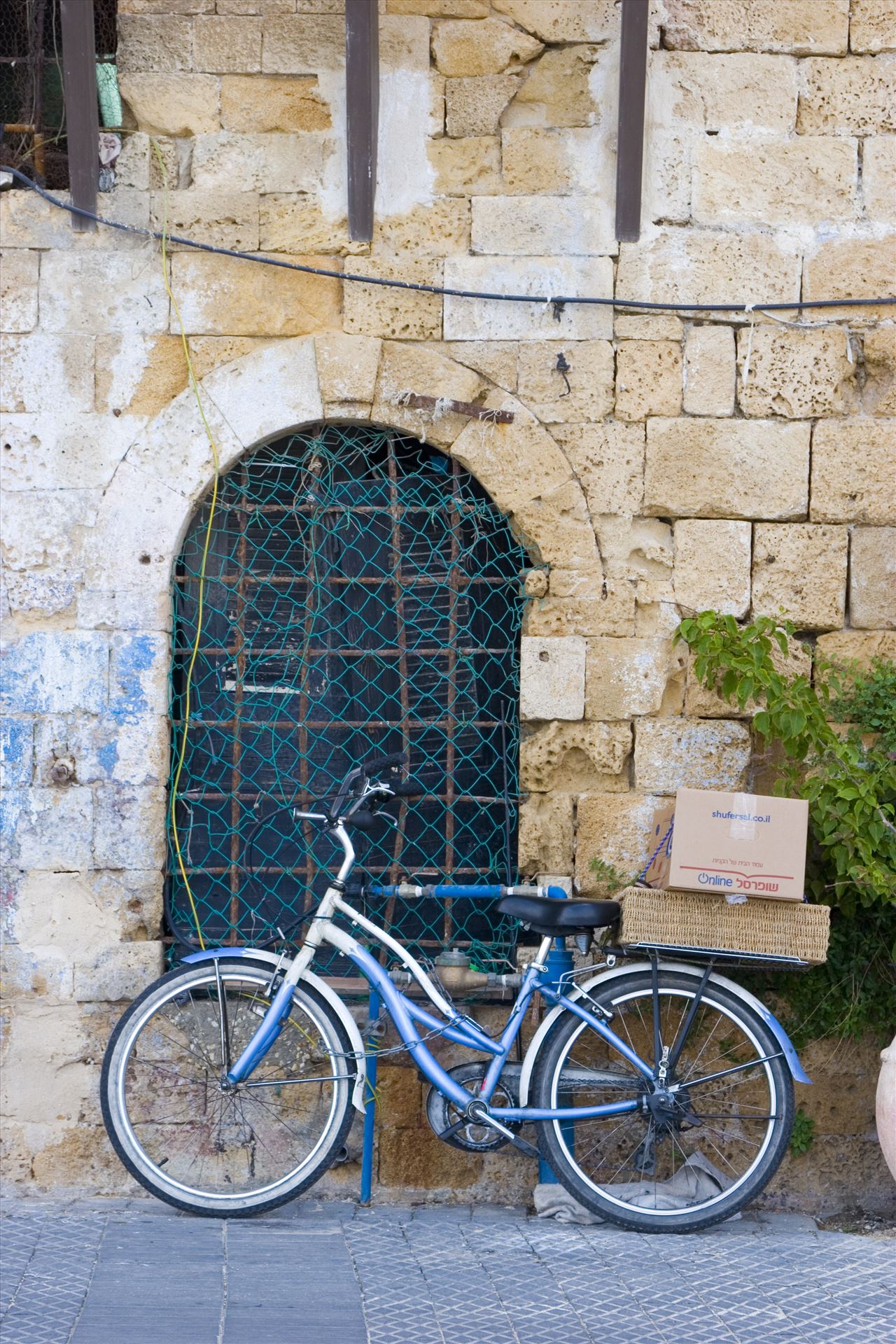 Solo Bike Parking Bicycle near an old building by Inna Ricardo-Lax Photography