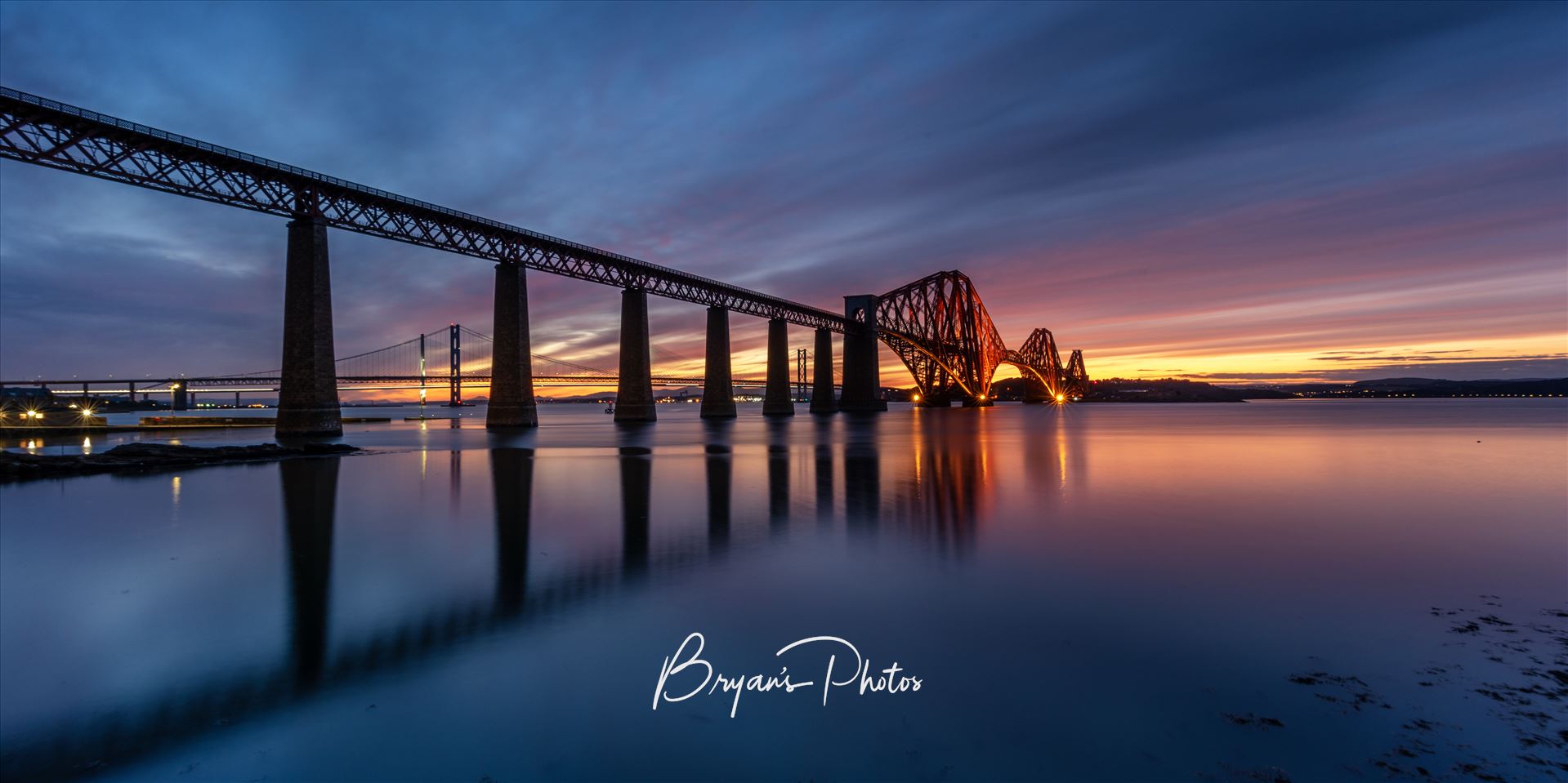 South Queensferry Sunset Panorama A panoramic photograph of the Forth Rail Bridge taken at sunset from the banks of the river Forth at South Queensferry. by Bryans Photos