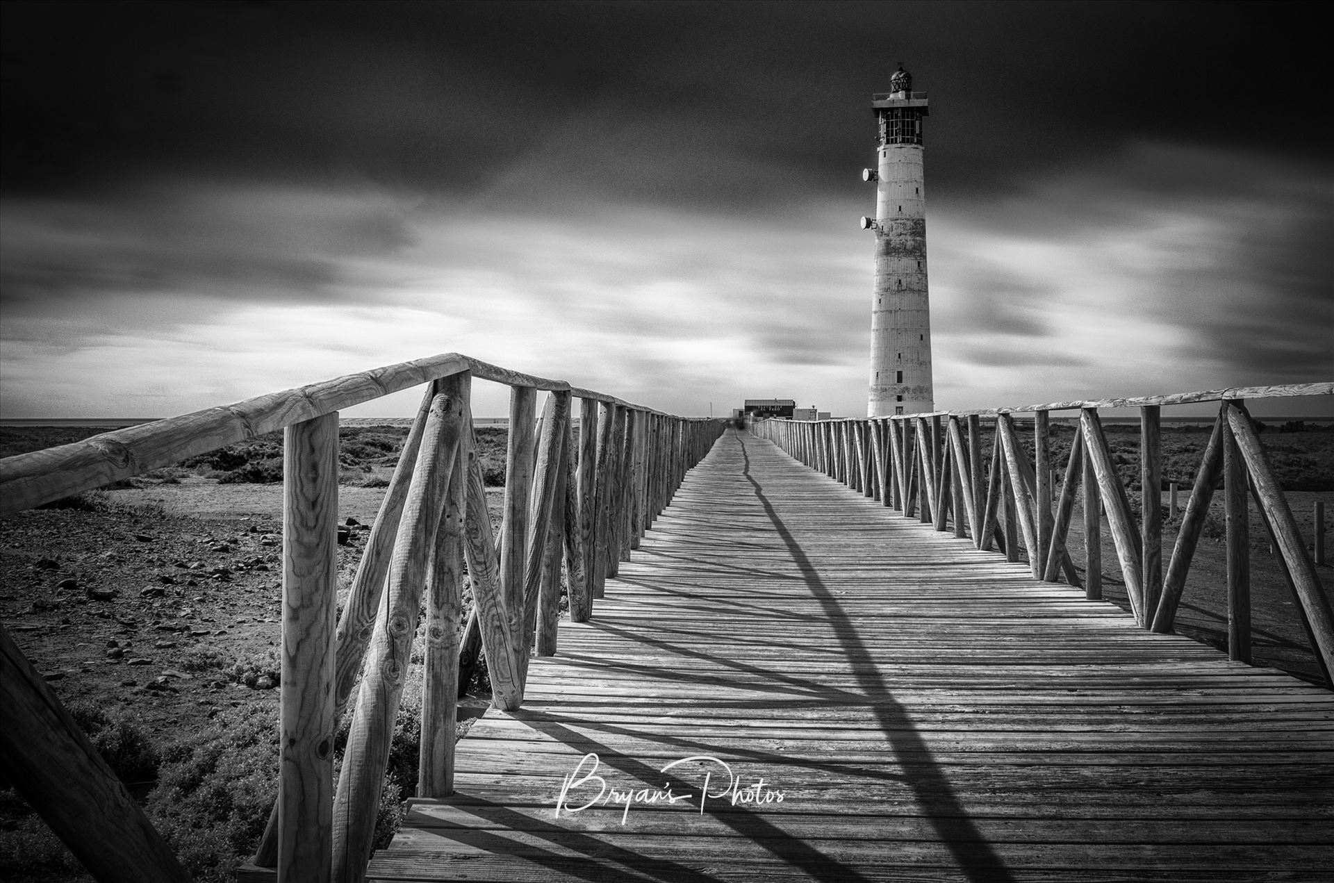 Morro Jable Lighthouse A black and white long exposure photograph of the lighthouse at Morro Jable Jandia Fuerteventura. by Bryans Photos