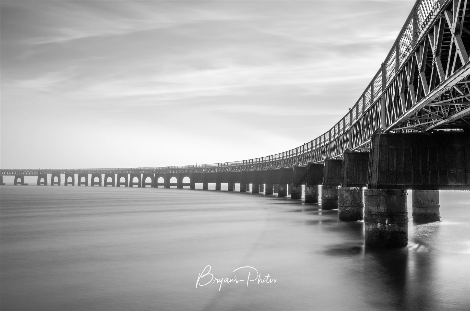 A Bridge to Fife A black and white photograph of the Tay Rail Bridge looking towards Fife. by Bryans Photos