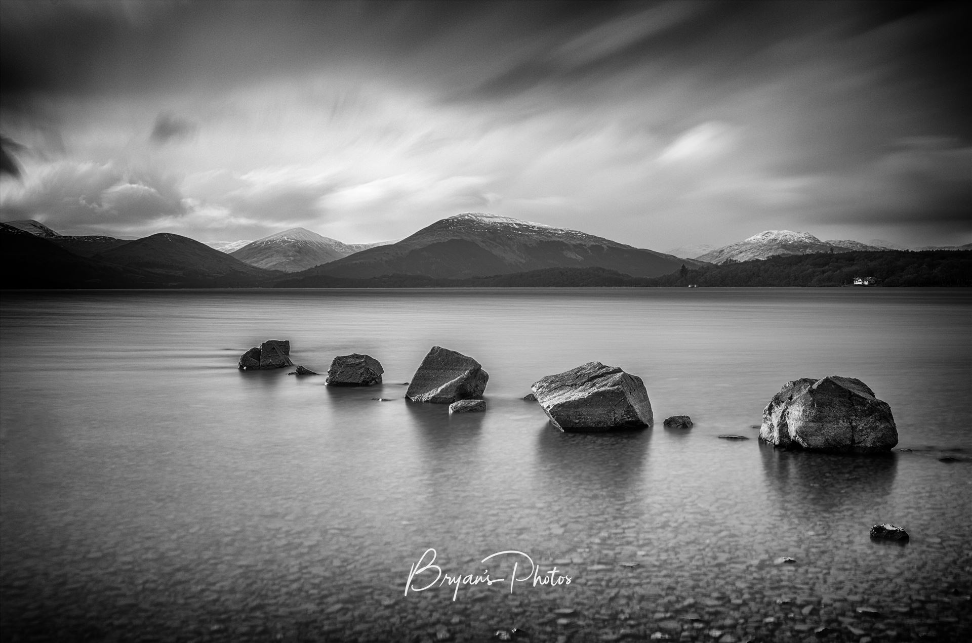 Milarrochy Rocks Landscape A black and white long exposure photograph of Loch Lomond taken from Milarrochy Bay. by Bryans Photos