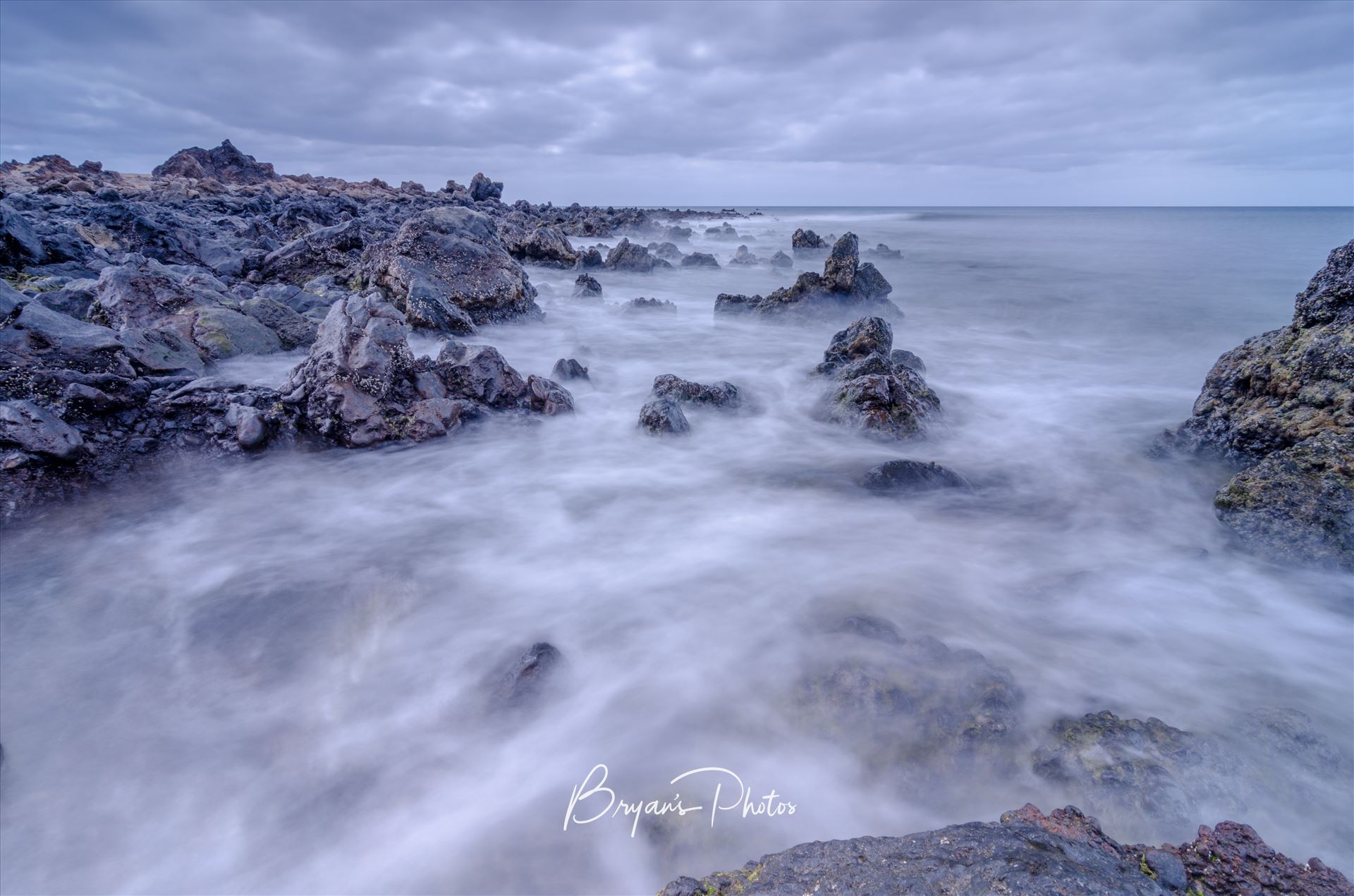Lanzarote Seascape A photograph taken from the beach at Los Piccolos Lanzarote looking out over the Atlantic Ocean. by Bryans Photos