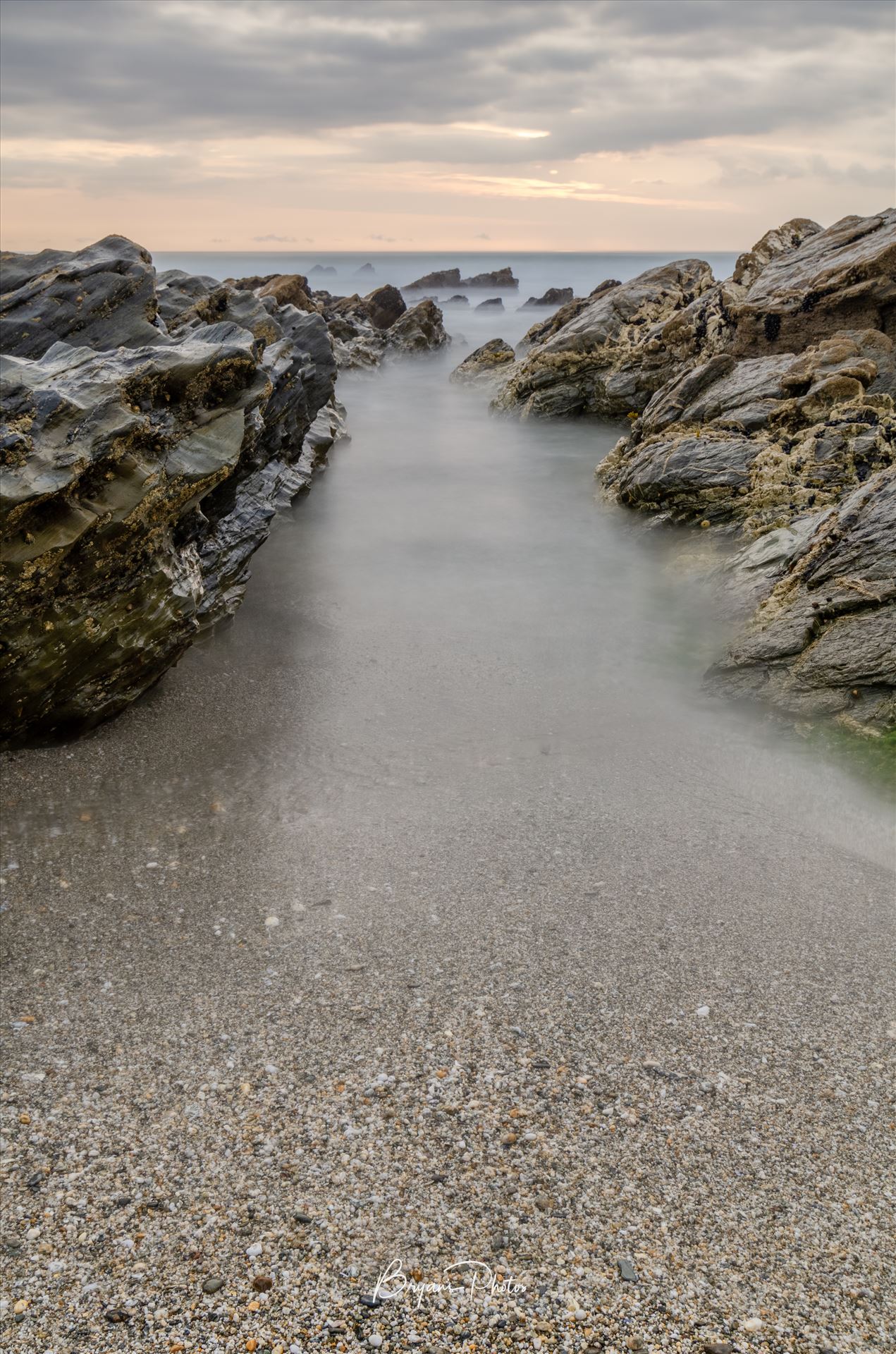 Little Fistal Portrait A long exposure photograph of Little Fistral Beach Newquay taken as the tide goes out. by Bryans Photos