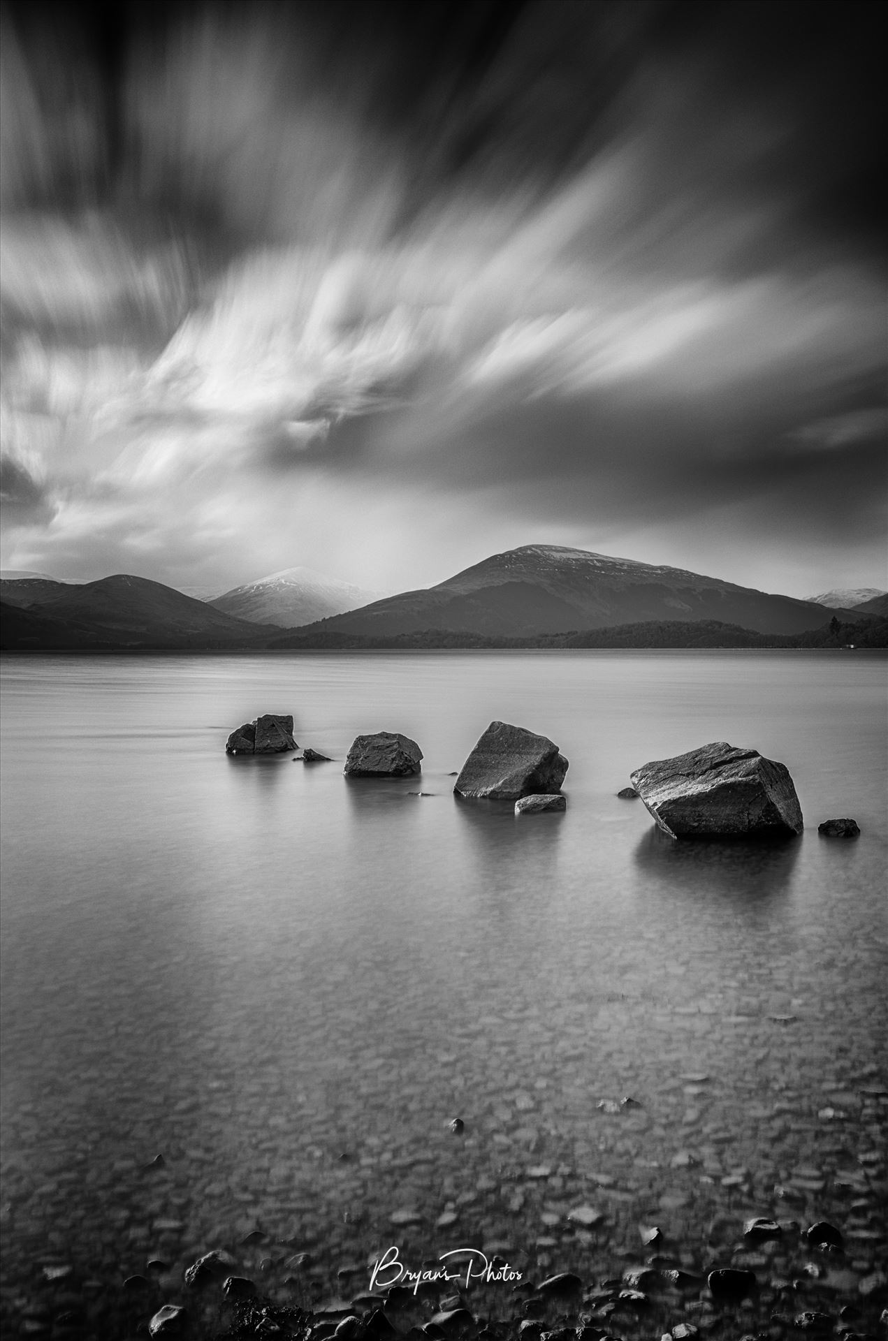 Loch Lomond A black and white long exposure photograph of Loch Lomond taken from Milarrochy Bay. by Bryans Photos