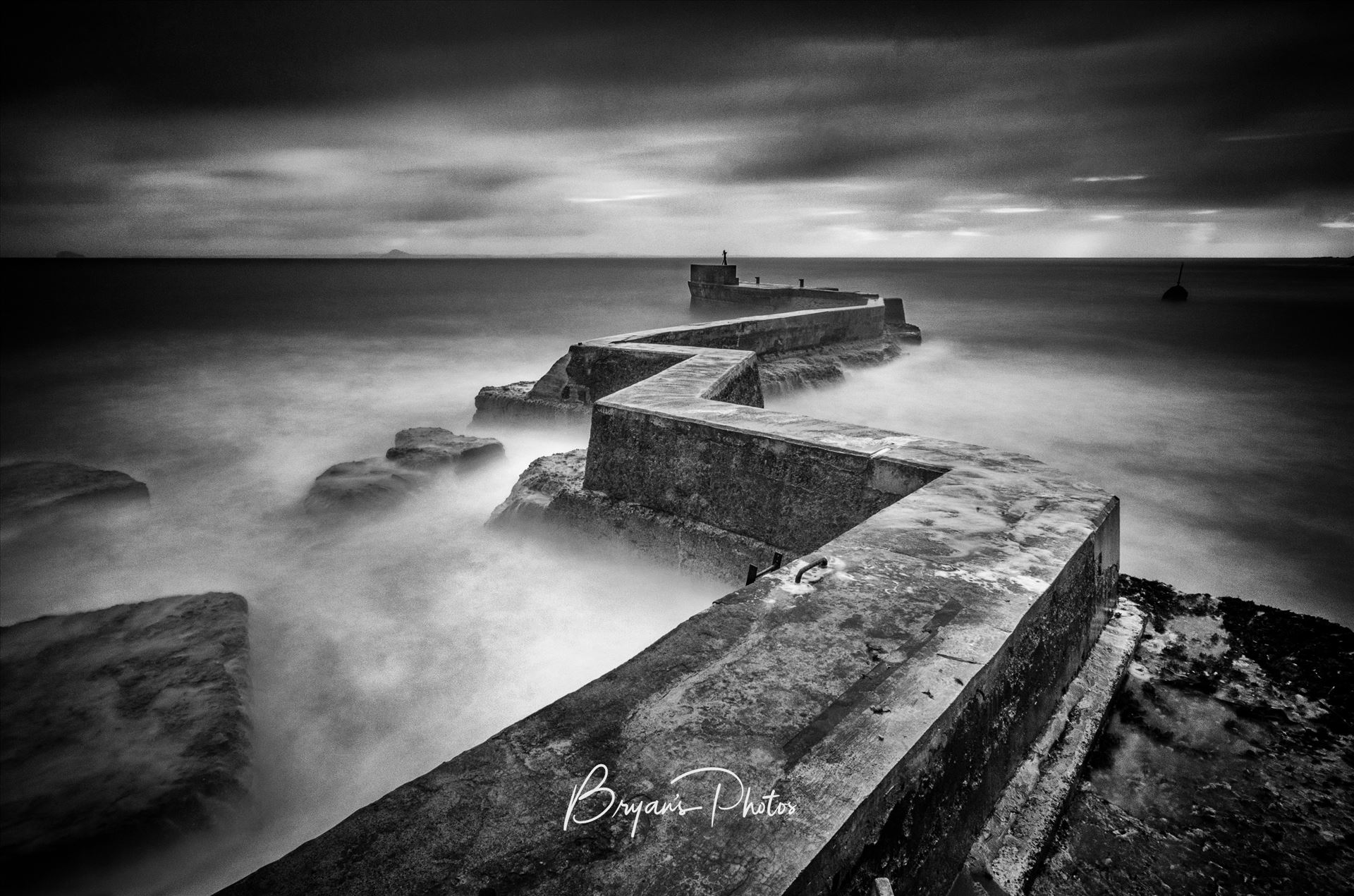 St Monans Breakwater A black and white Photograph of the breakwater at St Monans on the Fife coast. by Bryans Photos