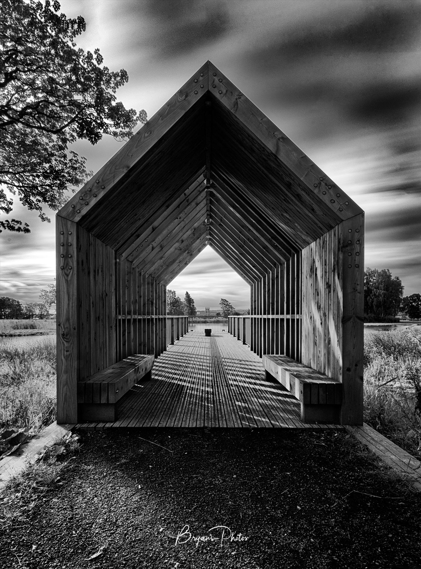 The Boathouse A black and white photograph of the boathouse at Larbert loch within the grounds of Forth Valley Royal Hospital. by Bryans Photos