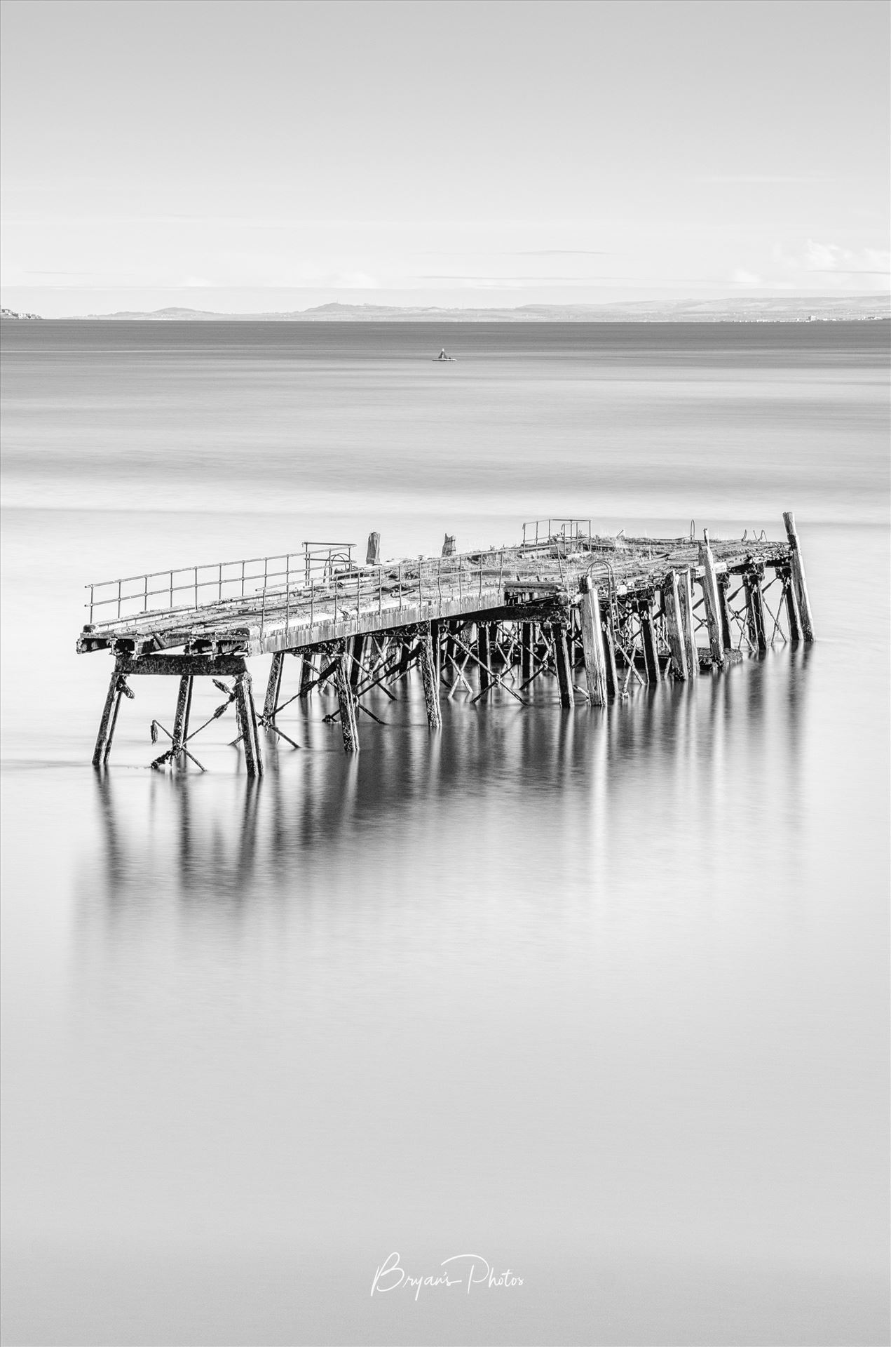 Carlingnose Pier A black and white photograph of the remains of Carlingnose Pier on the Fife coast of Scotland. by Bryans Photos