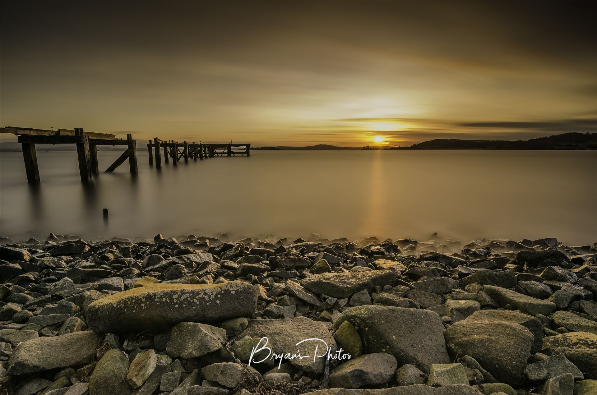 Sunset at Hawkcraig A long exposure photograph of the abandoned  Hawkcraig pier at Aberdour taken at sunset. by Bryans Photos