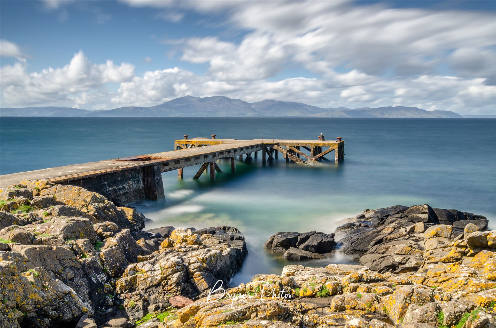 Portencross A photograph of the pier at Portenross looking over towards the Isle of Arran. by Bryans Photos