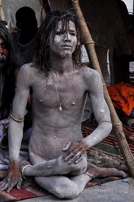 Culture- Naga Sadhu’s (India) A young Naga Sadhu in Yogic posture at Varanasi Ghat. by Anil Sharma Photography
