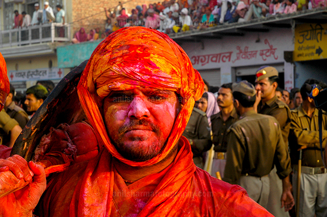 Festivals- Lathmaar Holi of Barsana (India) A man daubed in color powder during Lathmaar Holi at Barsana, Mathura, Uttar Pradesh, India. by Anil Sharma Photography