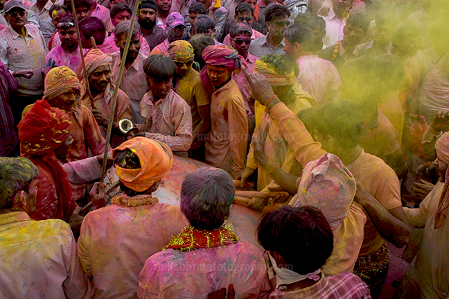 Festivals- Lathmaar Holi of Barsana (India) Large number of people gathered sprinkle colored powder, singing, dancing during Lathmaar Holi celebration at Barsana. by Anil Sharma Photography
