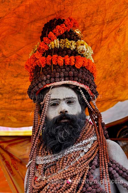 Culture- Naga Sadhu’s (India) Naga Sadhu with headdress of Rudraksha bead and marigold malas at Varanasi. by Anil Sharma Photography