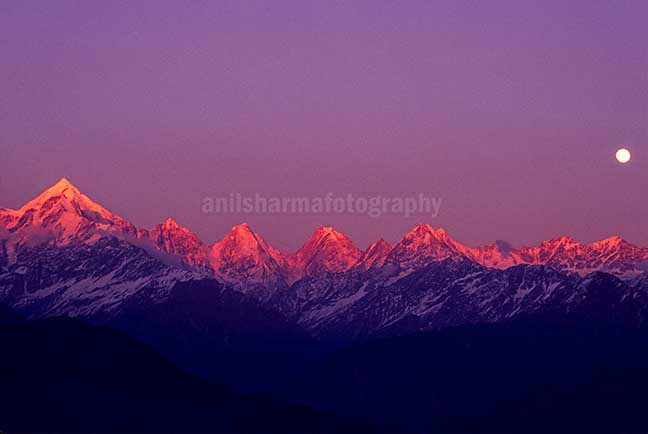 Nature-  Panchchuli Peaks Pink color Panchchuli Peaks and full moon in the sky view from Munsyari at Uttarakhand, India. by Anil Sharma Photography