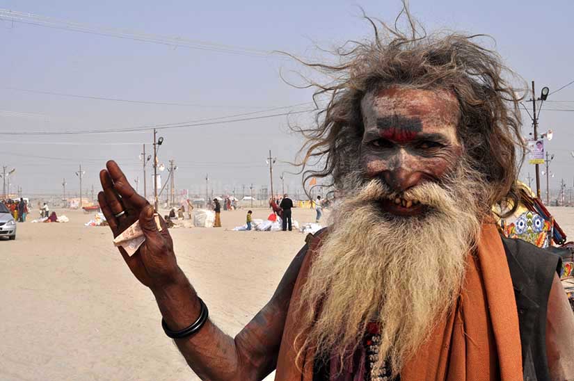 Culture- Aghori Sadhu's (India) Smile of an old Aghori Sadhu with long hairs, ash on face at Mahakumbh Prayag, Allahabad, Uttar Pradesh (India). by Anil Sharma Photography